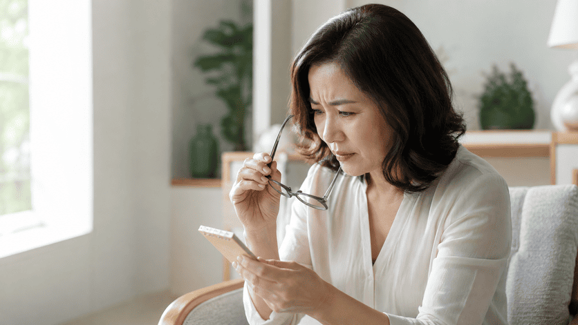 mature-woman-squinting-smartphone-presbyopia-symptom
